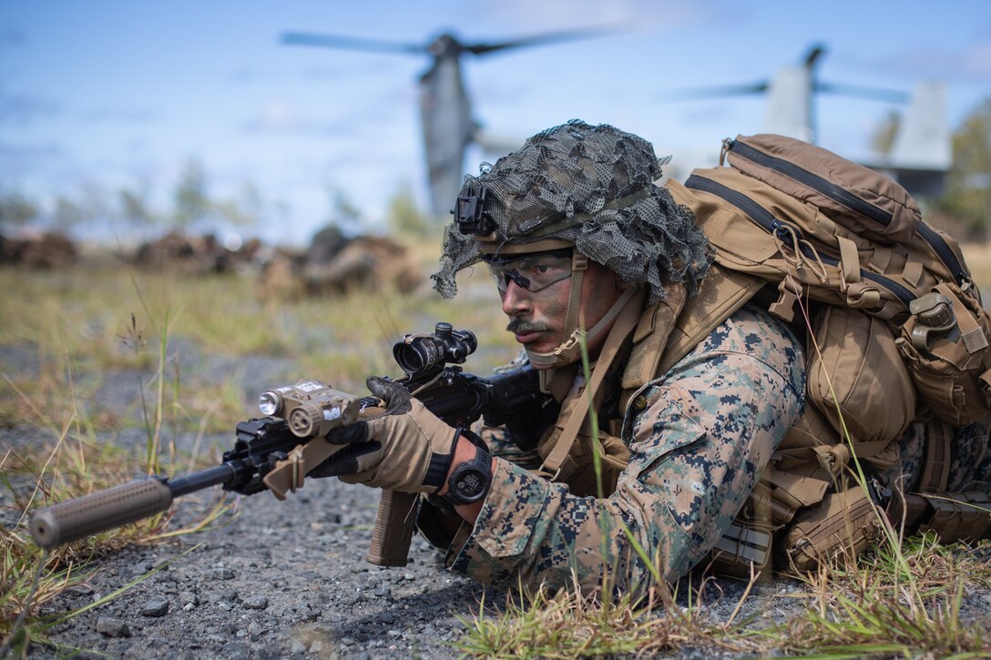 U.S. Marine Corps Cpl. Kevin Hernandez, a rifleman with 1st Battalion, 3rd Marines, 3rd Marine Division, provides security during an air assault at Marine Corps Training Area Bellows, July 9, 2021. The training strengthened the battalion’s proficiency in urban operations, while demonstrating their ability to quickly seize and defend key maritime terrain. 1/3 is training to become the first Littoral Combat Team in accordance with Force Design 2030. Hernandez is a native of Azle, Texas.