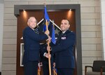 Col. Michael C. Brice, 433rd Medical Group commander, presents the 433rd Aerospace Medicine Squadron guidon to newly promoted Col. Luis A. Berrios during an assumption of command ceremony at Joint Base San Antonio-Lackland, Texas, July 10, 2021. A tradition in military heritage, passing the unit’s flag from one person to another signifies transfer of command. (U.S. Air Force photo by Tech. Sgt. Iram Carmona)