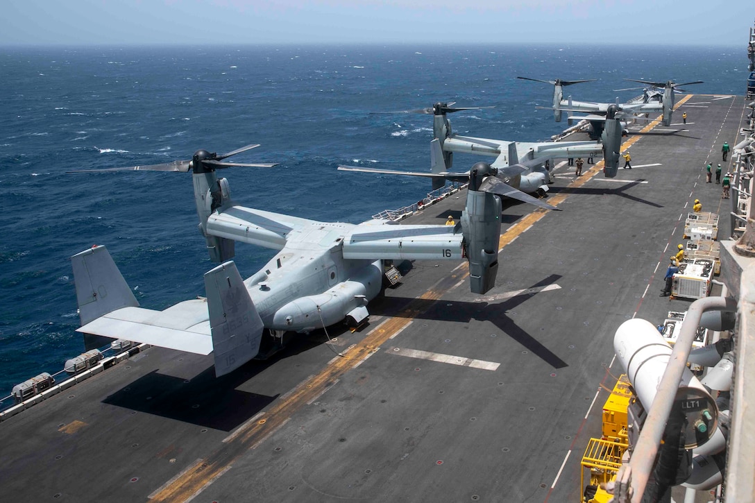 GULF OF ADEN (July 10, 2021) MV-22B Osprey tiltrotor aircraft, attached to Marine Medium Tiltrotor Squadron (VMM) 162 (Reinforced), undergo pre-flight checks on the flight deck of amphibious assault ship USS Iwo Jima (LHD 7) during flight operations in the Gulf of Aden, July 10. Iwo Jima is deployed to the U.S. 5th Fleet area of operations in support of naval operations to ensure maritime stability and security in the Central Region, connecting the Mediterranean and Pacific through the western Indian Ocean and three strategic choke points. (U.S. Navy photo by Mass Communication Specialist Seaman Isaac A. Rodriguez)