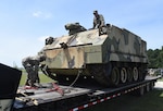 Virginia National Guard Soldiers assigned to the G4 Maintenance Assistance and Instruction Team offload an M84 self-propelled 4.2 mortar carrier June 25, 2021, at the VNG's Sergeant Bob Slaughter Headquarters at Defense Supply Center Richmond, Virginia.