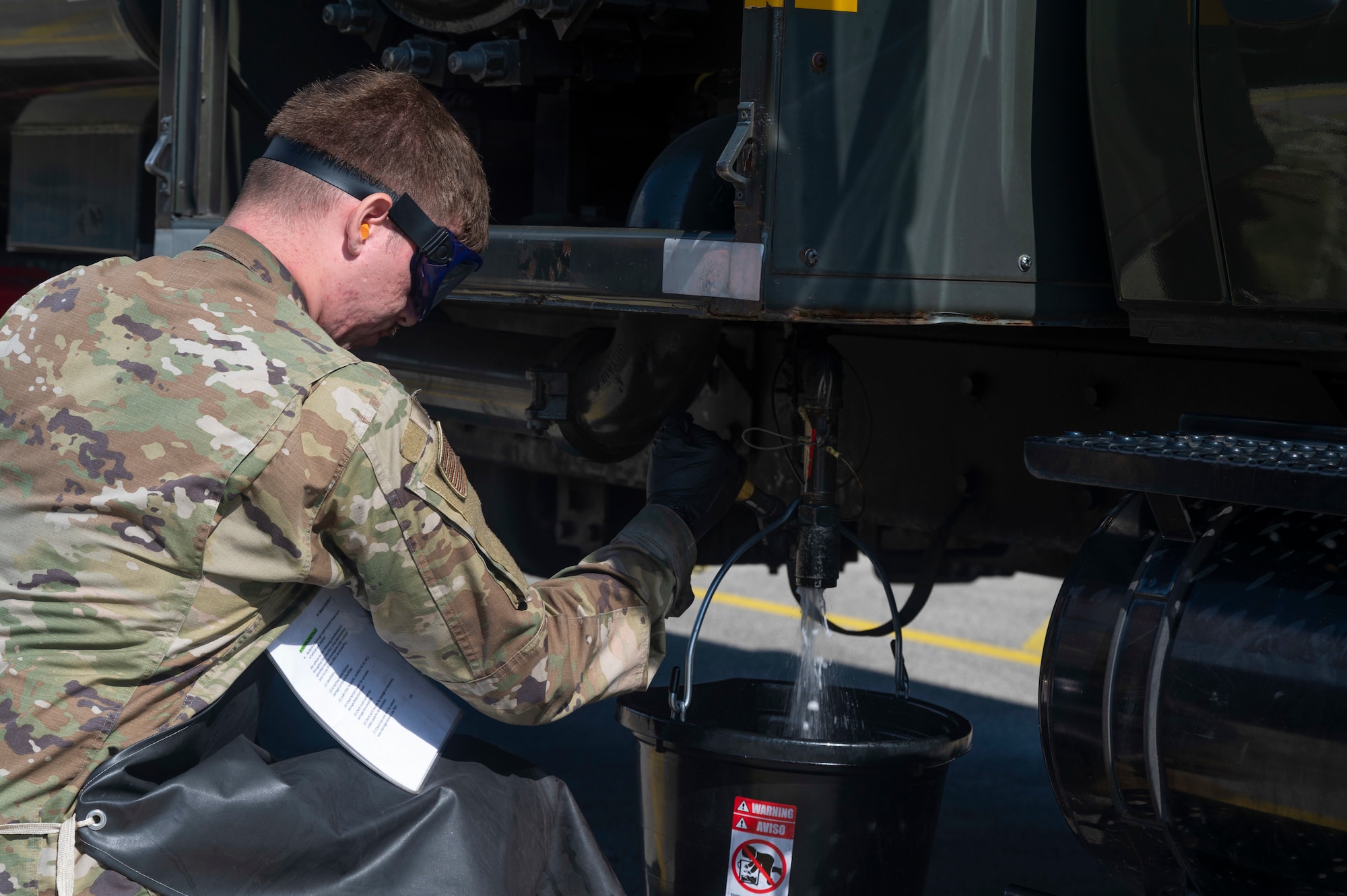 U.S. Air Force Airman Gregory Spradley, 86th Logistics Readiness Squadron fuels distribution operator, drains a fuel truck during a morning inspection