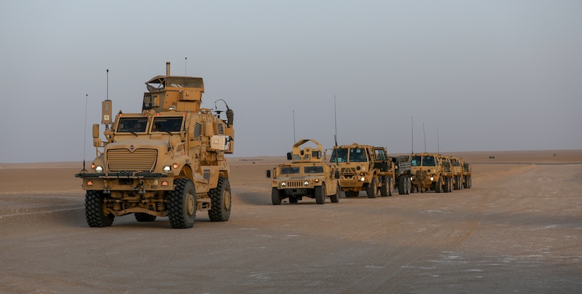 A MaxxPro Mine Resistant Ambush Protected (MRAP) vehicle belonging to Task Force Iron Valor waits in a column to move to a firing position at Udairi Range, Kuwait, June 2, 2021. TF Iron Valor conducted a night exercise to help Soldiers better prepare for live fire missions. (U.S. Army photo by Cpl. Kyle Burks)