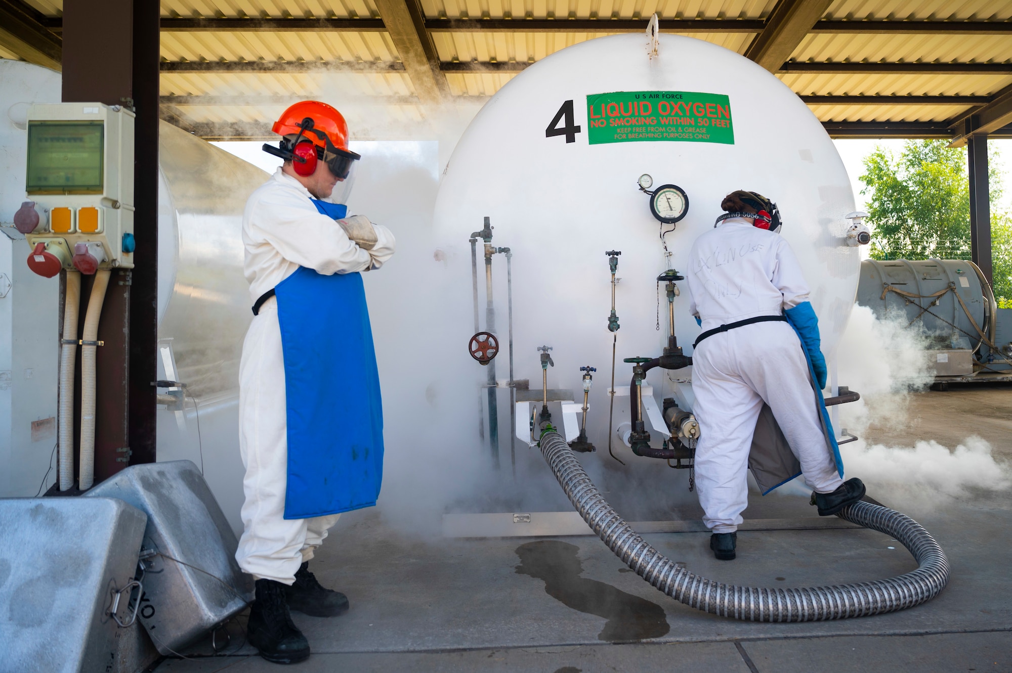 U.S. Air Force Senior Airman Aaron Irving, 86th Logistics Readiness Squadron fuels facilities operator, left, and Airman 1st Class Amber Butler 86th LRS fuels facilities operator check the levels of liquid oxygen