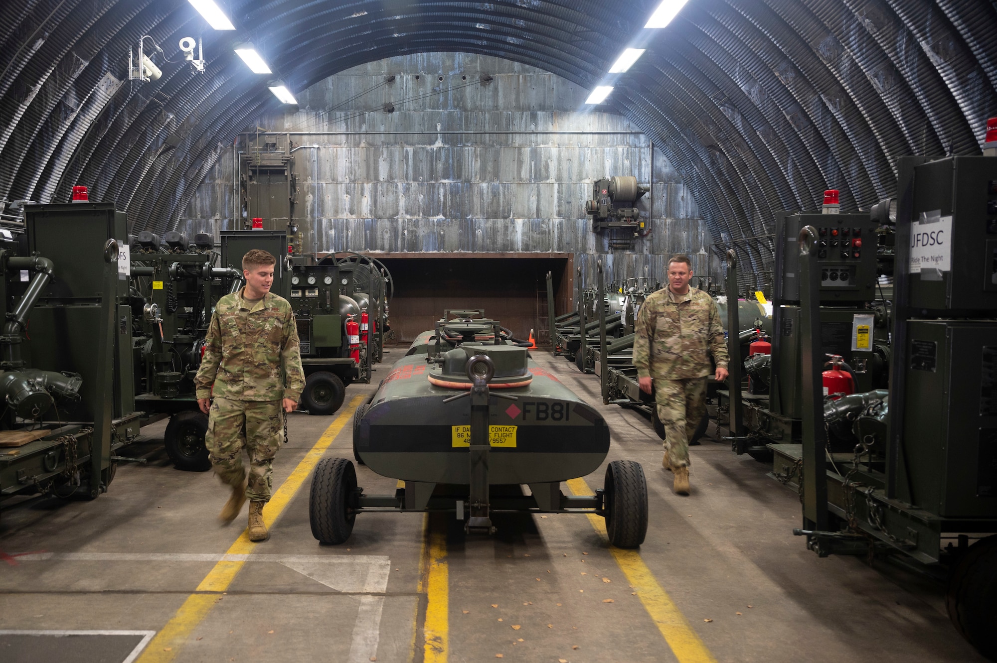 U.S. Air Force Staff Sgt. Bryant Griffith, 86th Logistics Readiness Squadron, left, and Tech. Sgt. Drew Killian, 86th LRS fuels environmental and safety office noncommissioned officer in charge, conducts an inspection of reserve fuel equipment