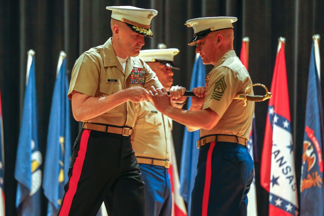 U.S. Marine Corps Maj. Gen. Jason Q. Bohm, the Commanding General of Marine Corps Recruiting Command (MCRC), congratulates Sgt. Major Cortez L. Brown, the out-going MCRC Sergeant Major, during the MCRC Sergeant Major relief and appointment ceremony at Little Hall, Marine Corps Base Quantico, Va., July 9, 2021. During the ceremony, Sgt. Maj. Cortez L. Brown was relieved as the MCRC Sergeant Major while Sgt. Maj. Adan F. Moreno was appointed as the new MCRC Sergeant Major.  (U.S. Marine Corps photo by Lance Cpl. Jennifer Sanchez)
