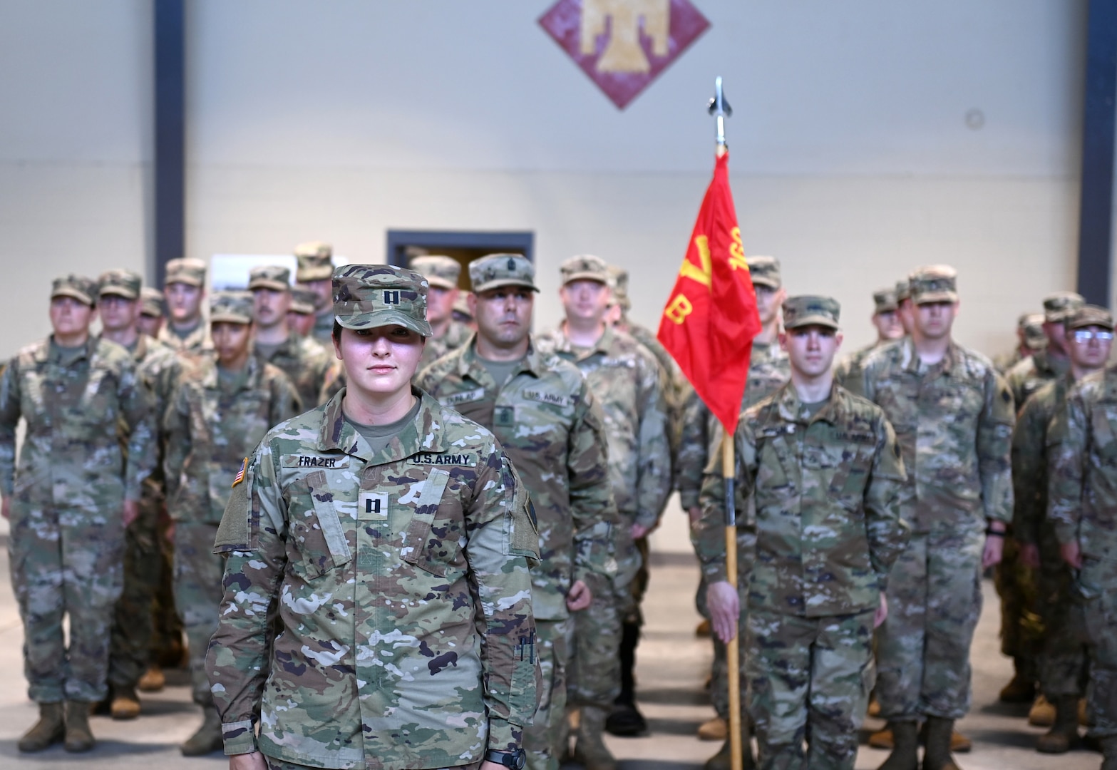 Capt. Marissa Frazer stands at attention command during a change of command ceremony at the National Guard armory in Holdenville, Oklahoma, July 9. Frazer assumed command of Bravo Battery, 1st Battalion, 160th Field Artillery Regiment, 45th Infantry Brigade Combat Team, Oklahoma Army National Guard, as the first female commander of a combat arms unit in the 45th IBCT. (Oklahoma National Guard Photo by Sgt. 1st Class Mireille Merilice)