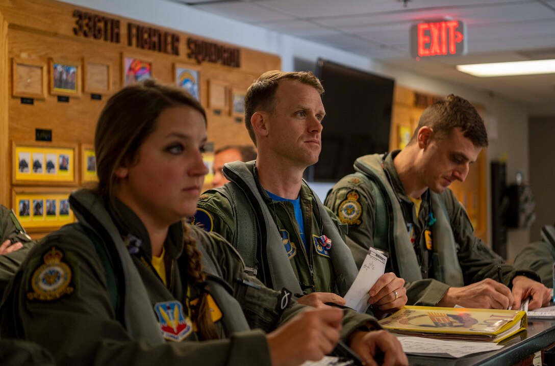 Maj. David Hook, 50th Flying Training Squadron instructor pilot, is briefed at Seymour Johnson Air Force Base, North Carolina, July 9, 2021.