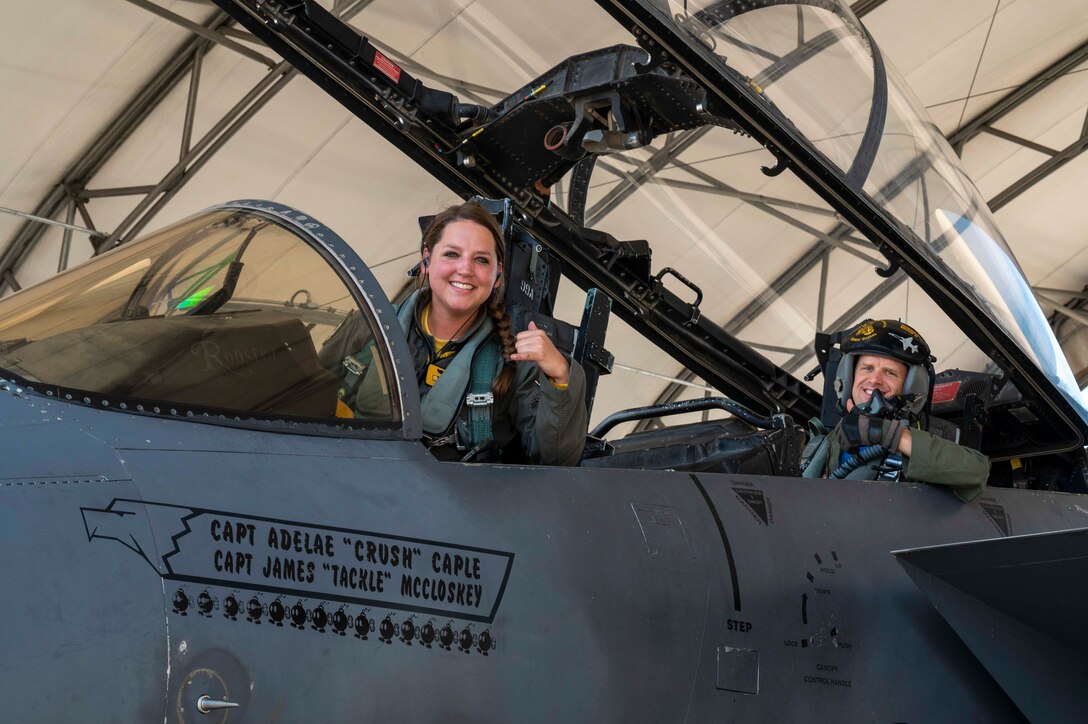 Capt. Adelae Caple, left, 336th Fighter Squadron pilot, and Maj. David Hook, 50th Flying Training Squadron instructor pilot, sits in the cockpit of an F-15E Strike Eagle at Seymour Johnson Air Force Base, North Carolina, July 9, 2021.