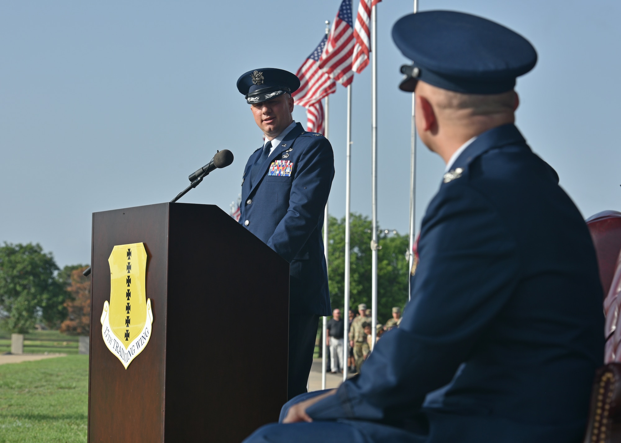 U.S. Air Force Col. Matthew Reilman, 17th Training Wing incoming commander, speaks to Col. Andres Nazario, 17th TRW outgoing commander, during the 17th TRW change of command ceremony on Goodfellow Air Force Base, Texas, July 13, 2021. Reilman transferred from the Pentagon, Washington, D.C. as the former Director of Staff Deputy Chief of Staff for Intelligence, Surveillance, and Reconnaissance and Cyber Effects Operations. (U.S. Air Force photo by Senior Airman Ashley Thrash)