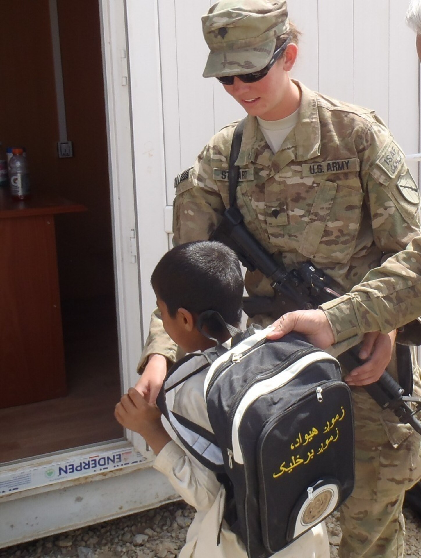 While the children's mothers trained on various agriculture aspects and Afghan laws pertaining to women, their children received organized education and school supplies with help from ADT 4