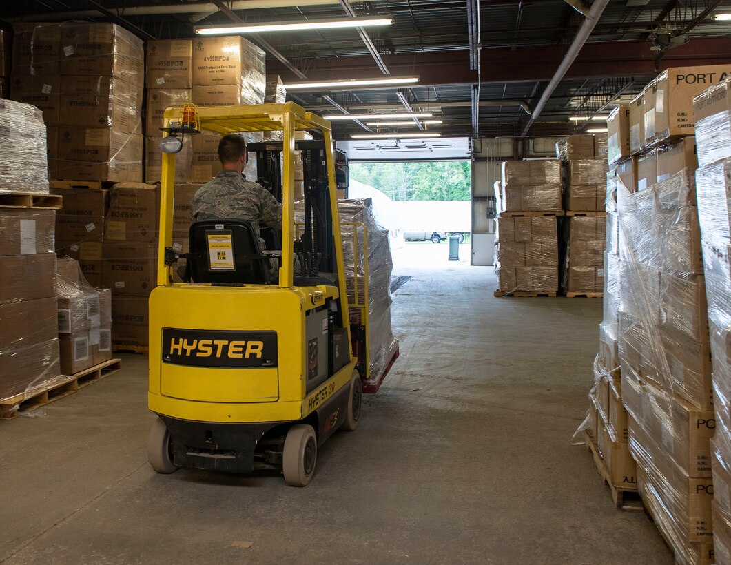 U.S. Air Force Airmen 1st Class Brett Woods from the 158th Fighter Wing, Vermont Air National Guard, maneuvers a forklift at the Strategic National Stockpile Warehouse, August 27, 2020. Airmen from across the 158th Fighter Wing have supported operations at the SNS Warehouse since March 2020, and continue to provide critical logistical support to enable Vermont's efforts to distribute Personal Protective Equipment throughout the state and conduct widespread testing for COVID-19. (U.S. Army National Guard photo by Capt. J. Scott Detweiler)