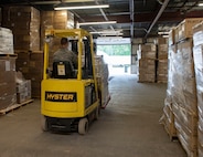 U.S. Air Force Airmen 1st Class Brett Woods from the 158th Fighter Wing, Vermont Air National Guard, maneuvers a forklift at the Strategic National Stockpile Warehouse, August 27, 2020. Airmen from across the 158th Fighter Wing have supported operations at the SNS Warehouse since March 2020, and continue to provide critical logistical support to enable Vermont's efforts to distribute Personal Protective Equipment throughout the state and conduct widespread testing for COVID-19. (U.S. Army National Guard photo by Capt. J. Scott Detweiler)