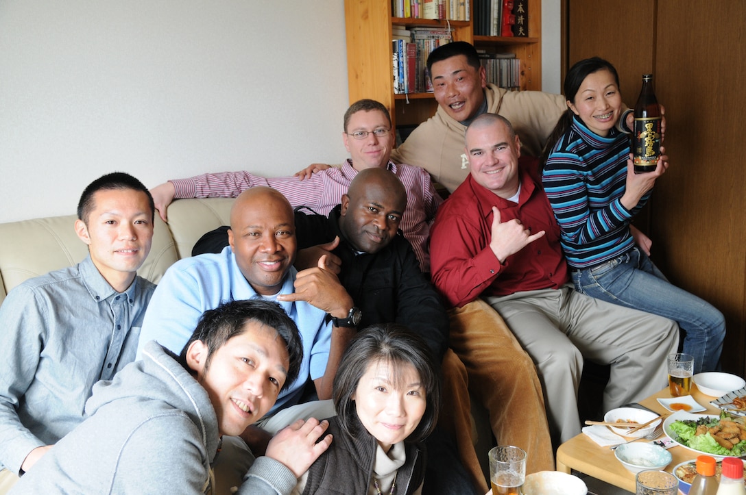 Military personnel enjoy traditional Japanese cuisine during a visit to the home of Maj. Yasuo Okamoto of the Japan Ground Self Defense Force, Jan. 29.