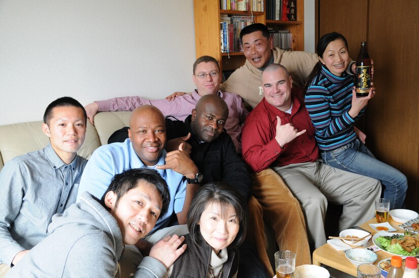 Military personnel enjoy traditional Japanese cuisine during a visit to the home of Maj. Yasuo Okamoto of the Japan Ground Self Defense Force, Jan. 29.