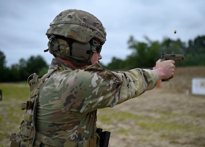 Staff Sgt. Dean Van Tassel of A Battery, 3-197th Field Artillery Brigade, fires an M17 pistol during the NHNG annual combat marksmanship competition July 8, 2021,a t Fort Devens, Mass.