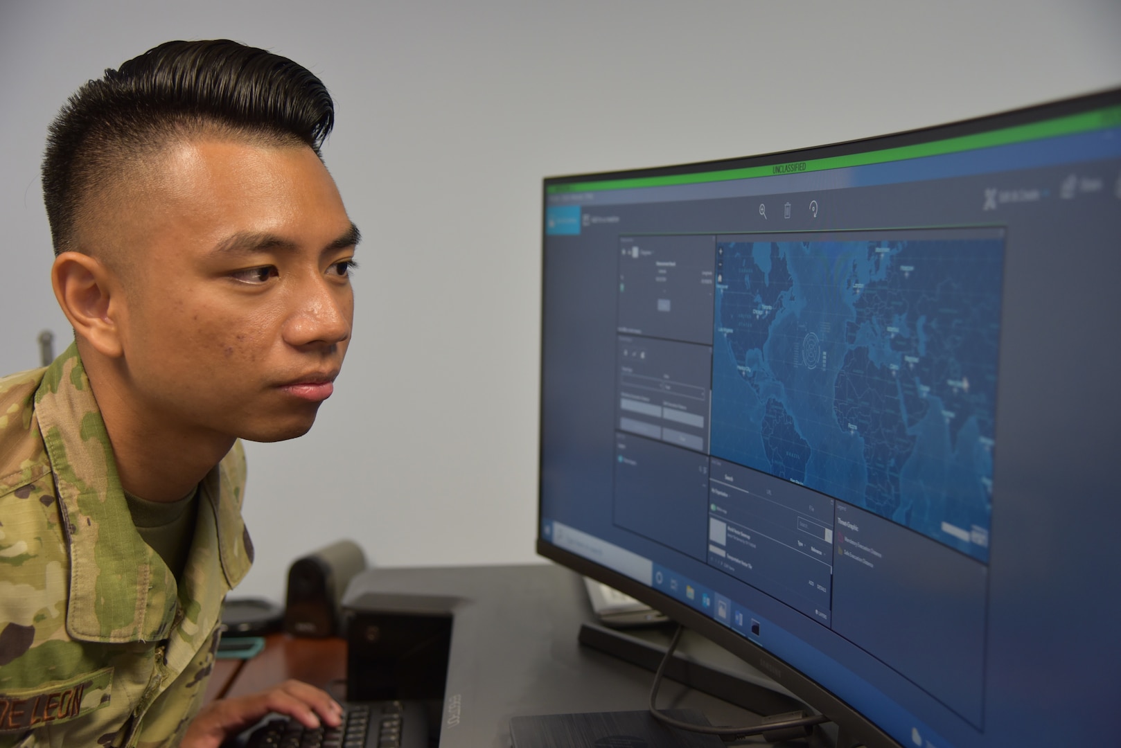Staff Sgt. Steven De Leon views an unclassified version of a geospatial web application depicting the measurement tool and threat analysis feature of the Phoenix Oracle website. The New Jersey Air National Guardsman is an intelligence analyst with the 204th Intelligence Squadron at Joint Base McGuire-Dix-Lakehurst and has been named the chief lead of the team developing this Air Mobility Command-led web capability project.
