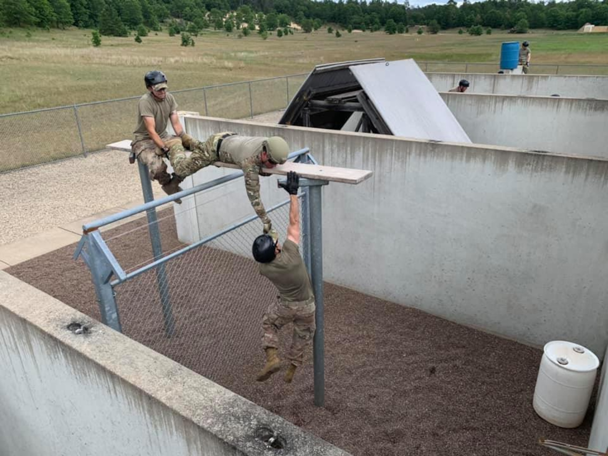 Airmen assigned to the Ohio Air National Guard's 178th Wing Security Forces Squadron conducted wartime skills training at the Volk Field Combat Regional Training Center, Wisc. from June 23-July 2 to enhance their air base ground defense skills. The Airmen improved many of their tactics and marksmanship skills using long range distance targets, land navigation, night operations, dismounted patrolling, tactical combat casualty care, and leadership development. (Photo provided)