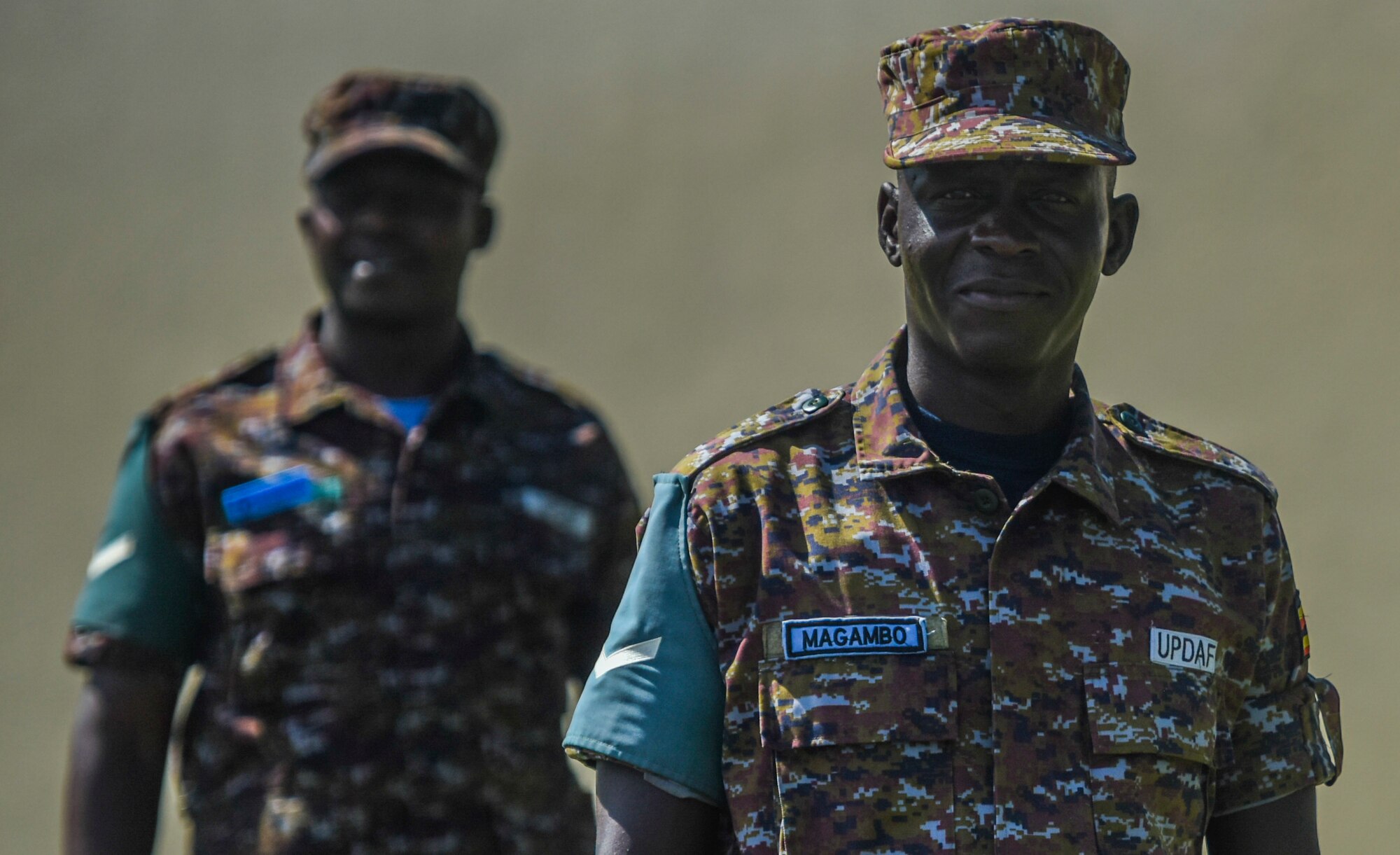 Ugandan Air Force Sgts. Magambo Charles and Turyamureba Daniel prepare for retreat at Joint Base Pearl Harbor-Hickam, Hawaii, June 27, 2021.  Daniel and Charles recently graduated Airman Leadership School from the Chief Master Sgt.  James C. Binnicker Professional Military Education Center.

(U.S. Air Force photo by Tech. Sgt. Anthony Nelson Jr.)