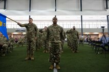 U.S. Airmen assigned to the 354th Communications Squadron (CS) render the first squadron salute to their new commander during a change of command ceremony at Eielson Air Force Base, Alaska, July 9, 2021.