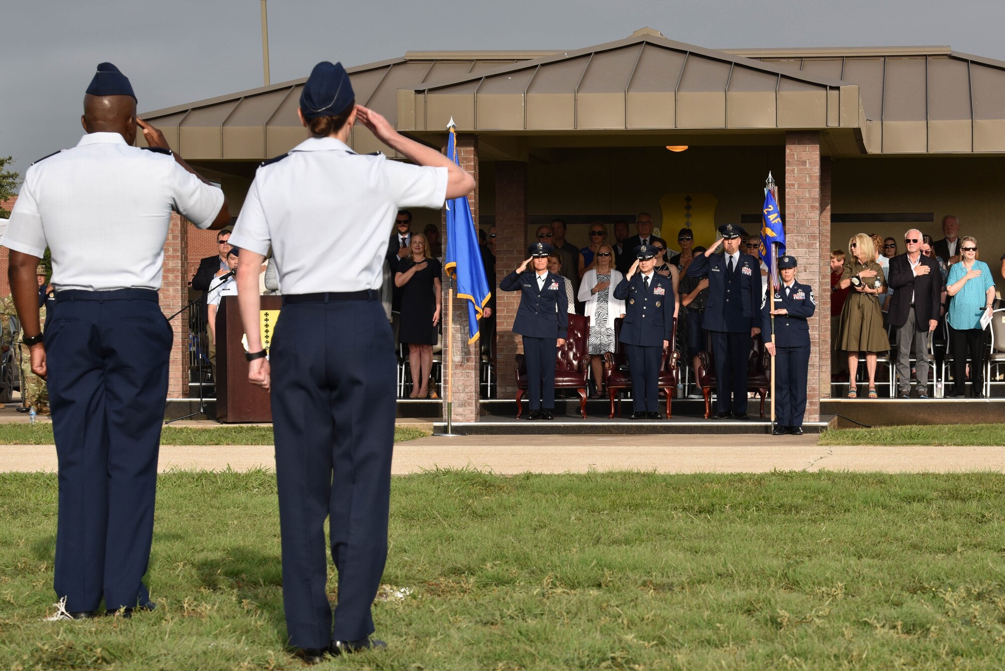 U.S. Air Force Col. James Finlayson, 17th Training Wing vice commander, salutes the official party during the 17th TRW change of command ceremony on Goodfellow Air Force Base, Texas, July 13, 2021. The change of command ceremony is a military tradition, which illustrates the formal transfer of authority by the passing the guidon from departing commander to incoming commander. (U.S. Air Force photo by Senior Airman Jermaine Ayers)