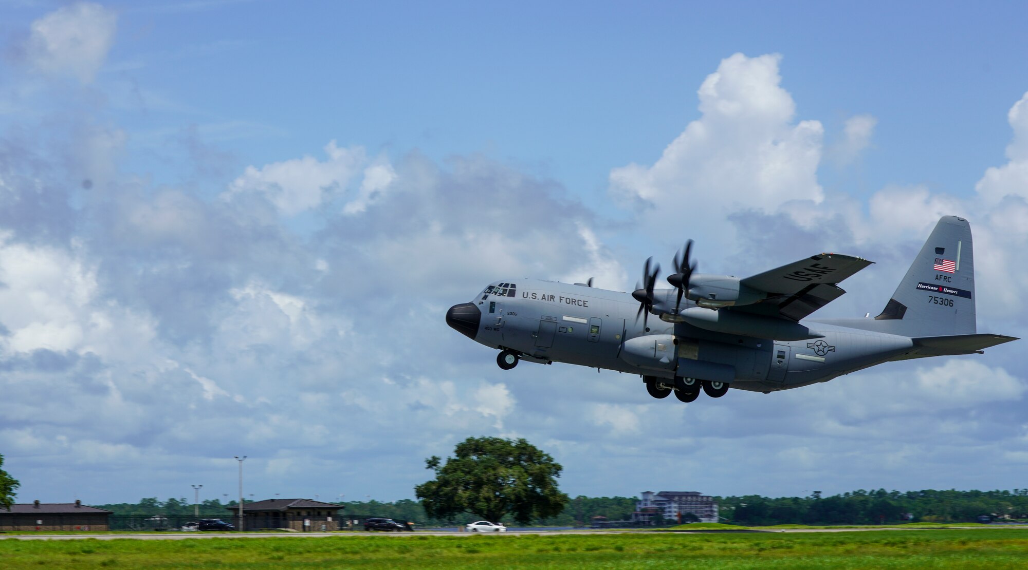 A WC-130J Super Hercules aircraft assigned to the 53rd Weather Reconnaissance Squadron at Keesler Air Force Base, Miss., takes off for its functional check flight July 13, 2021. This particular aircraft took off after months of extensive repairs to its wing caused by a fire that left a basketball-sized hole in the wing. (U.S. Air Force photo by 2nd Lt. Christopher Carranza)