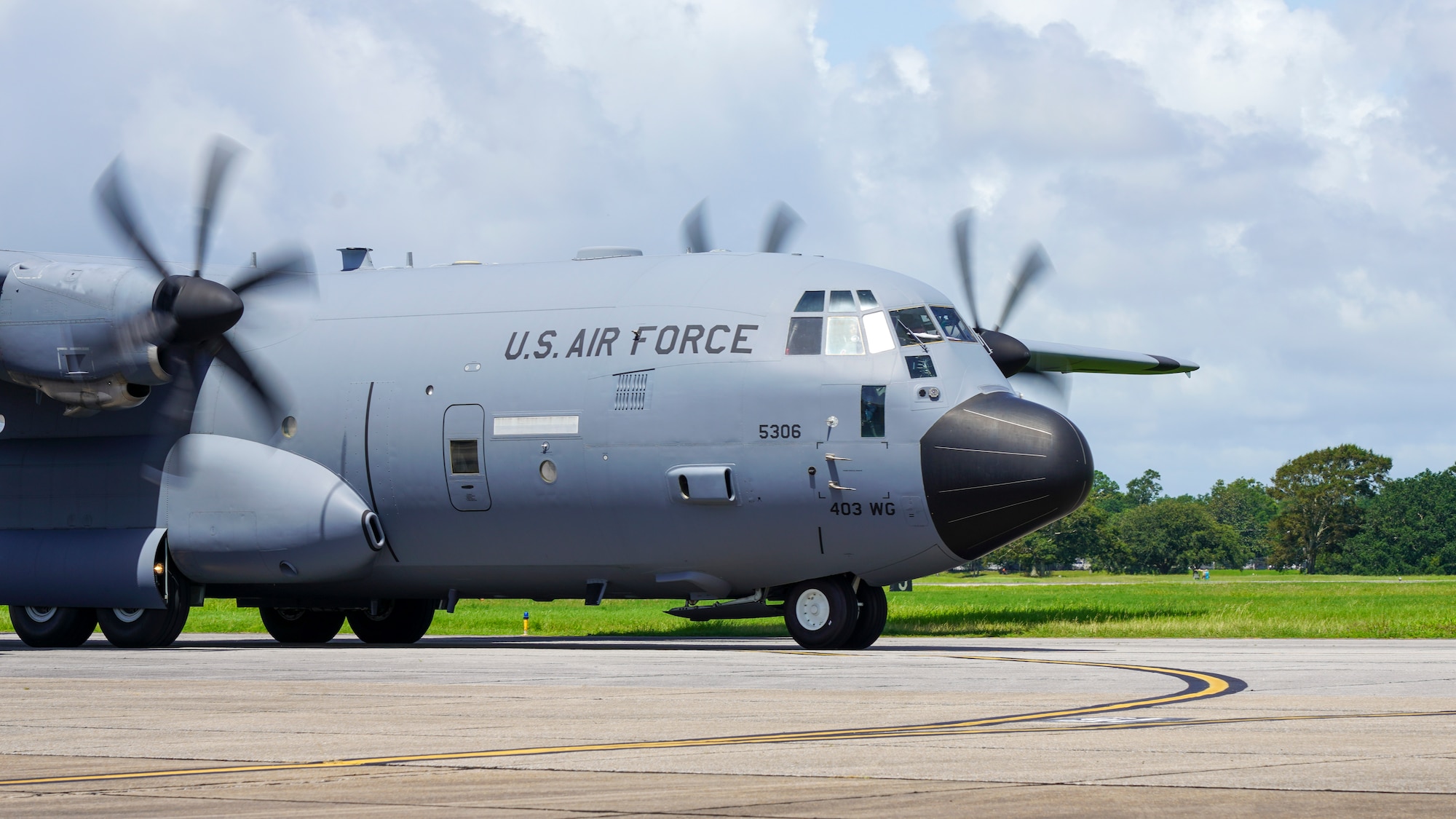 A WC-130J Super Hercules aircraft assigned to the 53rd Weather Reconnaissance Squadron at Keesler Air Force Base, Miss., taxis prior to its functional check flight July 13, 2021. This particular aircraft took off after months of extensive repairs to its wing caused by a fire that left a basketball-sized hole in the wing. (U.S. Air Force photo by 2nd Lt. Christopher Carranza)