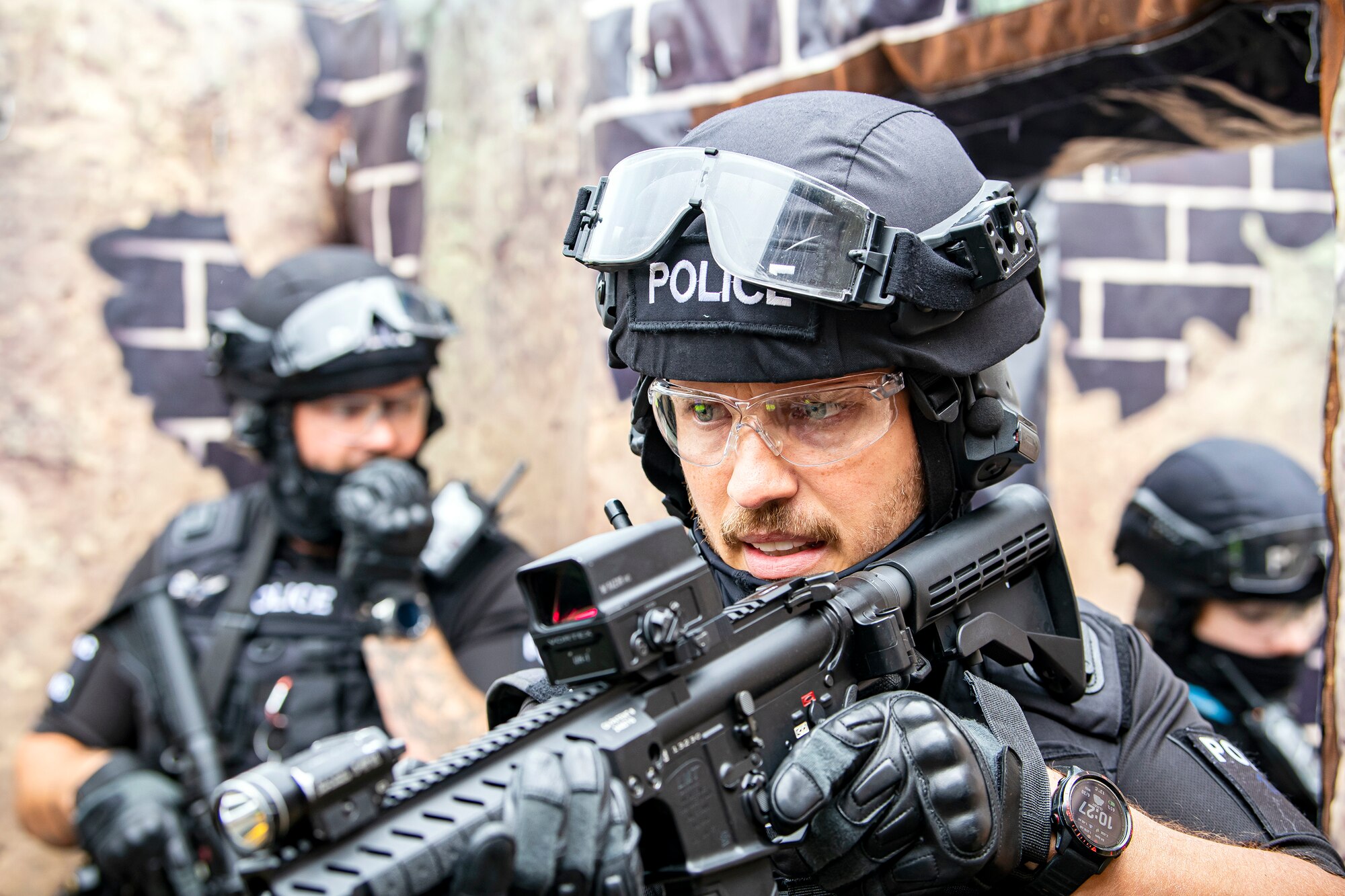 Police officers from the Northamptonshire Police Department, conduct a tri-agency active shooter response exercise at RAF Croughton, England, June 30, 2021. Airmen from the 422nd Security Forces Squadron along with police officers from the NHPD and Ministry of Defense, participated in multiple exercises to enhance their search and seizure tactics, strengthen local ties and gain rapport with their fellow officers. (U.S. Air Force photo by Senior Airman Eugene Oliver)