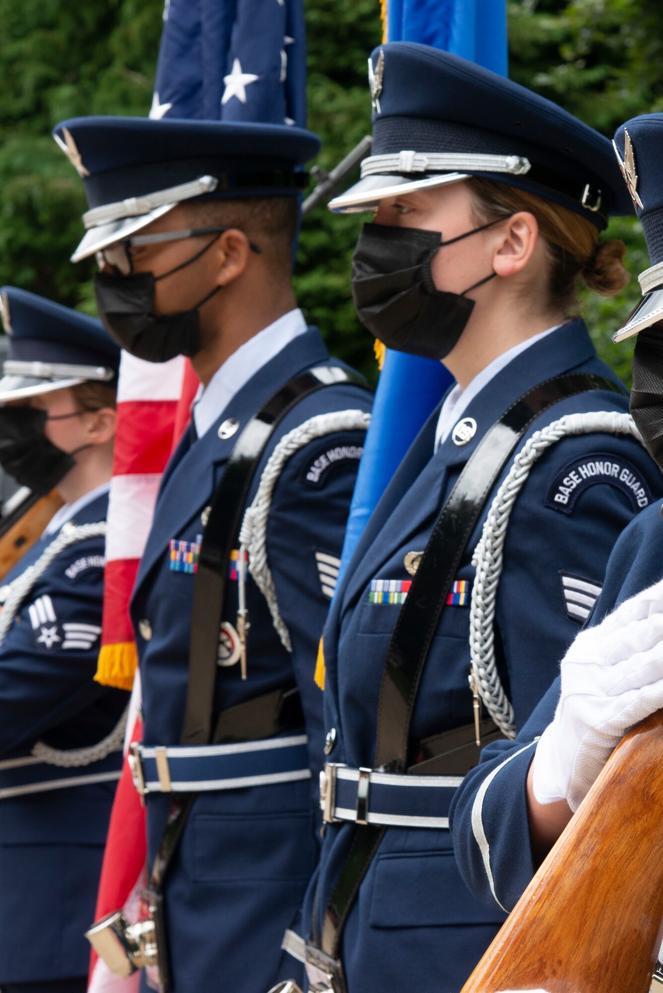 U.S. Air Force Honor Guardsman, from left, Staff Sgt. Thomas Green, 100th Logistics Readiness Squadron, and Senior Airman Madilyn Below, 100th Force Support Squadron, stand at attention during the Desert Rats memorial in High Ash, Thetford Forest, England, July 11, 2021. The honor guard service members held guidon in formation to commemorate soldiers from the division who had fallen during World War II. (U.S. Air Force photo by 1st Lt. Tyler Whiting)