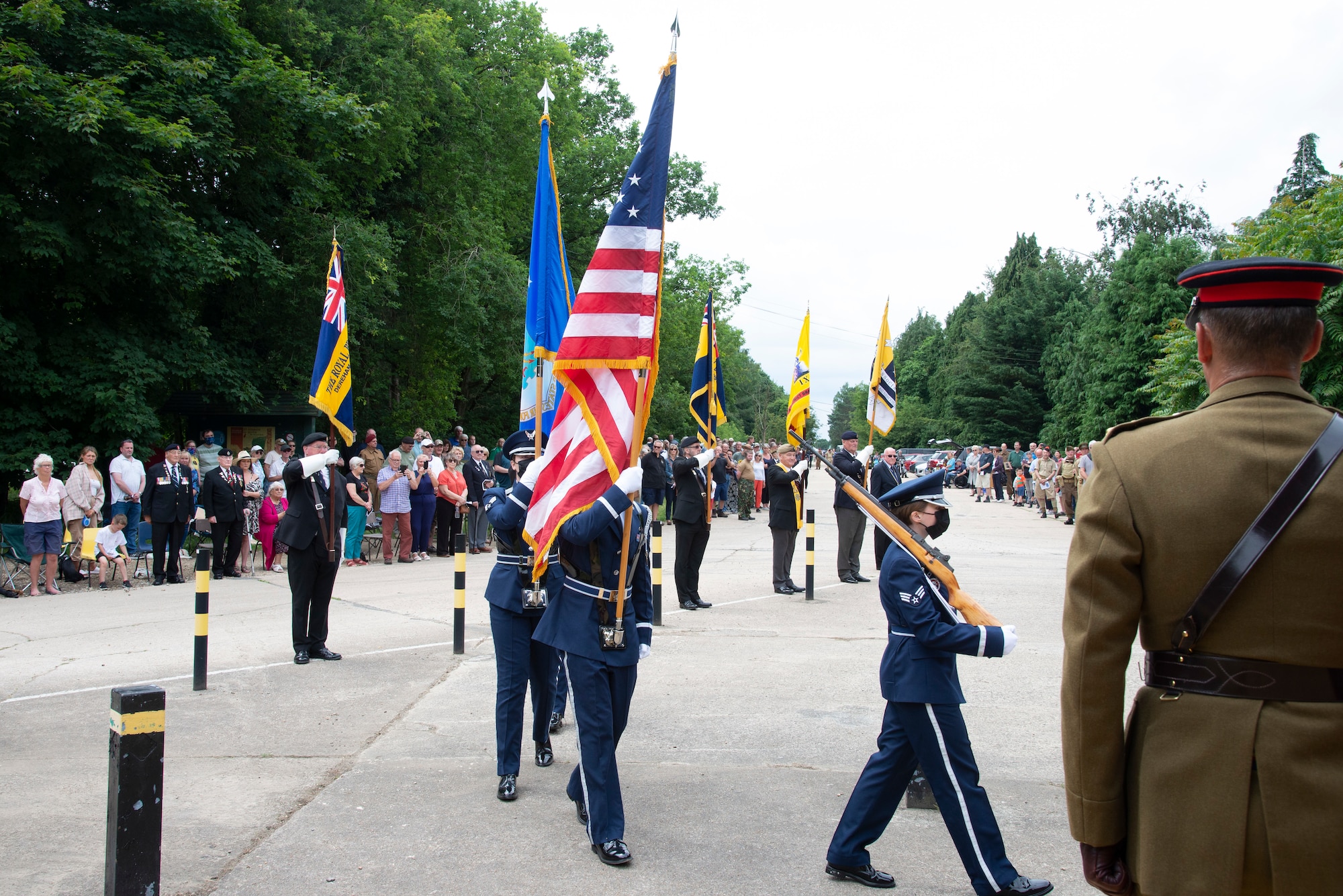 U.S. Air Force Honor Guard members assigned to the 100th Air Refueling Wing, Royal Air Force Mildenhall, England, march to a memorial in High Ash, Thetford Forest, June 11, 2021. Honor guard members marched to the 7th Armored Division Desert Rats memorial to honor those from the division who have fallen during World War II. (U.S. Air Force photo by 1st Lt. Tyler Whiting)