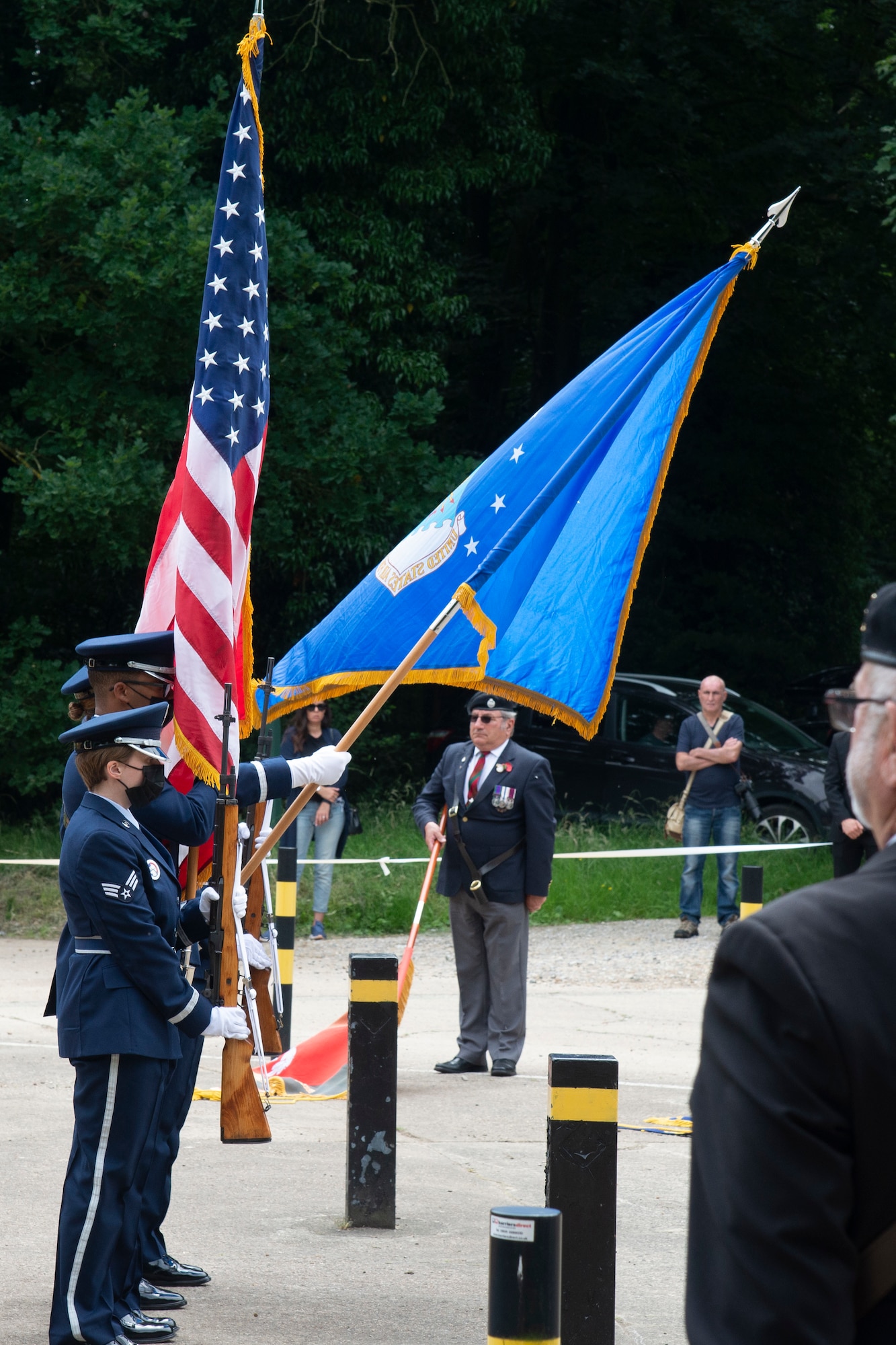 U.S. Air Force Honor Guard members assigned to the 100th Air Refueling Wing, Royal Air Force Mildenhall, England, stand in formation and present the colors for the Desert Rats memorial in High Ash, Thetford Forest, July 11, 2021. The honor guard presented the colors for the 7th Division Desert Rats and those who had fallen during World War II. (U.S. Air Force photo by 1st Lt. Tyler Whiting)