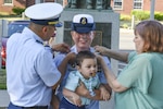 Master Chief Petty Officer Laurie A. Kennedy is pinned by her family members July 21, 2020 during a ceremony at the Coast Guard Yard in Baltimore. Kennedy is the first female to earn the title of master chief in the gunner’s mate rating and is slated to be the rating force master chief. (U.S. Coast Guard photo by Petty Officer 3rd Class Isaac Cross)