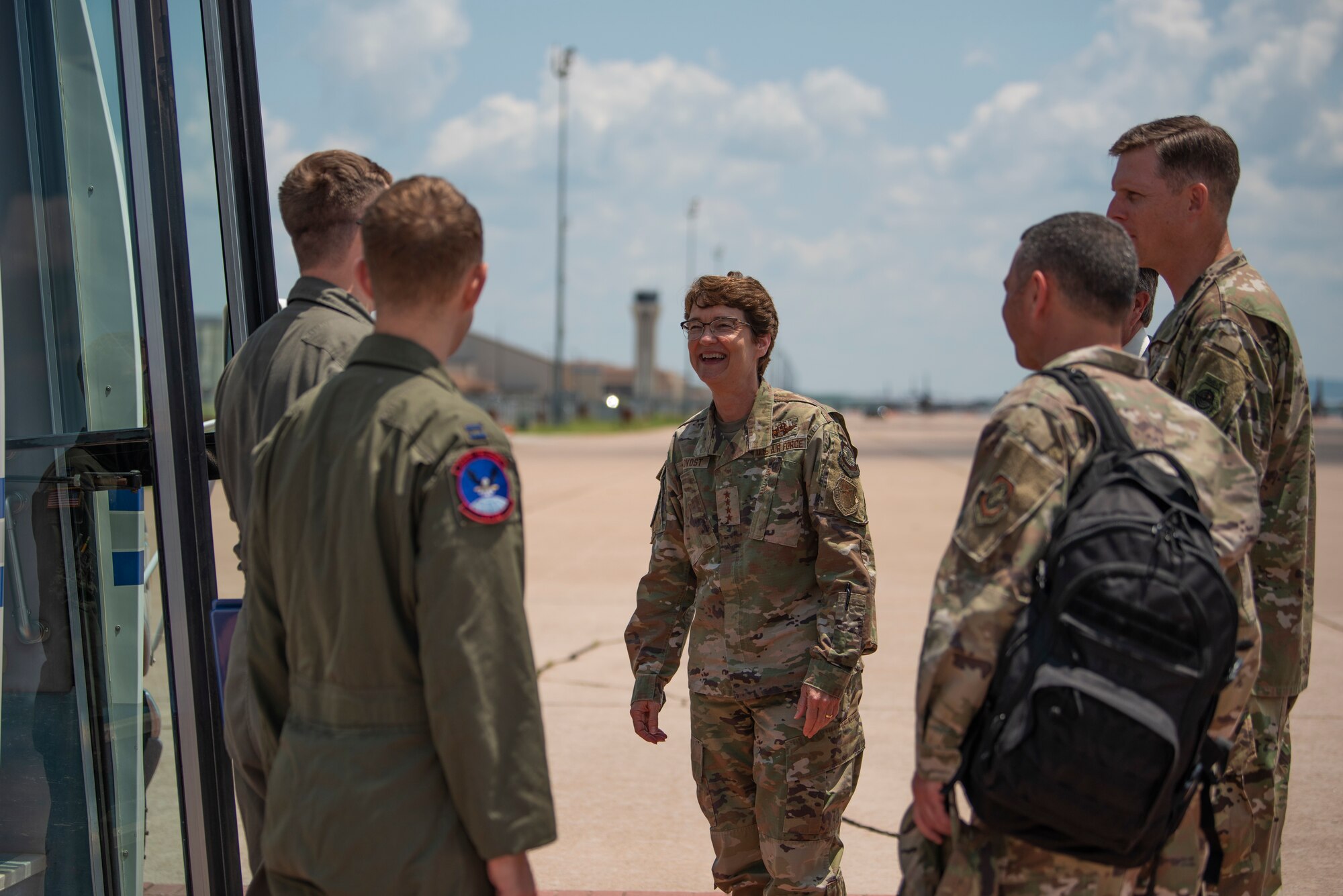 U.S. Air Force Gen. Jacqueline Van Ovost, Air Mobility Command commander, center, is greeted by Airman from the 317th Airlift Wing at Dyess Air Force Base, Texas, July 7, 2021. The AMC command team visited Dyess AFB where they met some of the Airmen accelerating the air mobility mission. (U.S. Air Force photo by Senior Airman Colin Hollowell)