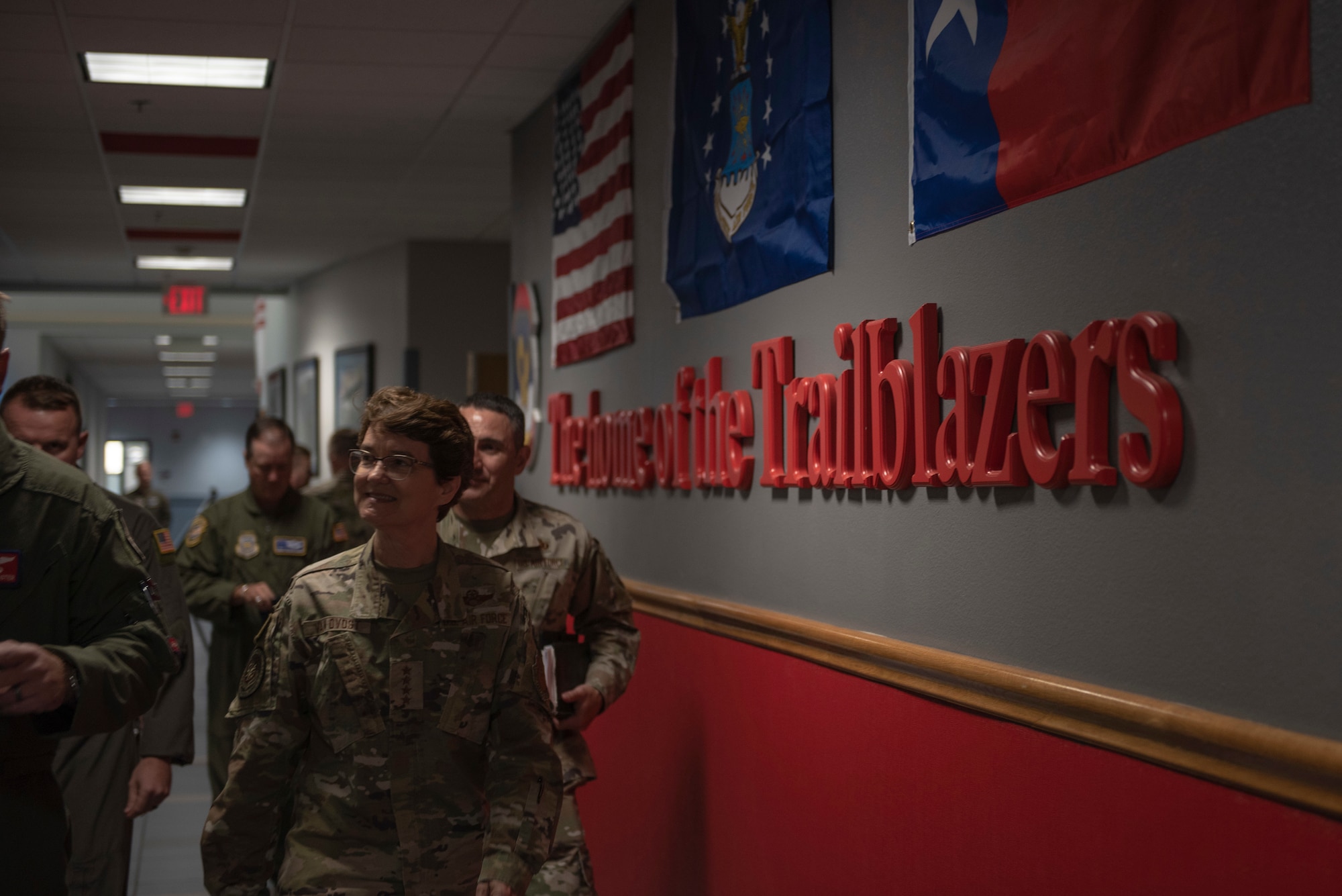 U.S. Air Force Gen. Jacqueline Van Ovost, Air Mobility Command commander, walks through the 317th Airlift Wing operations and maintenance building at Dyess Air Force Base, Texas, July 8, 2021. During the visit, Van Ovost was briefed on the accomplishments of the 317th AW at home station and deployed. (U.S. Air Force photo by Senior Airman Colin Hollowell)