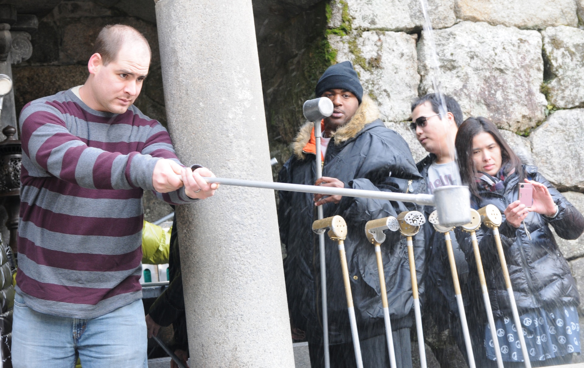 Military personnel take time during the Yama Sakura 61 exercise to visit the Kiyomizu Temple as a cultural experience.