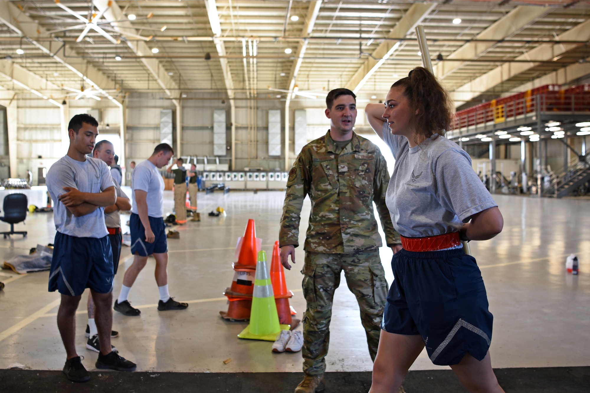 U.S. Air Force Staff Sgt. Travis Herr, 17th Medical Group physical medicine technician, assesses a 312th Training Squadron student's functional movements on Goodfellow Air Force Base, Texas, June 30, 2021. Students are evaluated in endurance, strength, flexibility, and mental wellness before starting their training to prevent injury. (U.S. Air Force photo by Senior Airman Abbey Rieves)