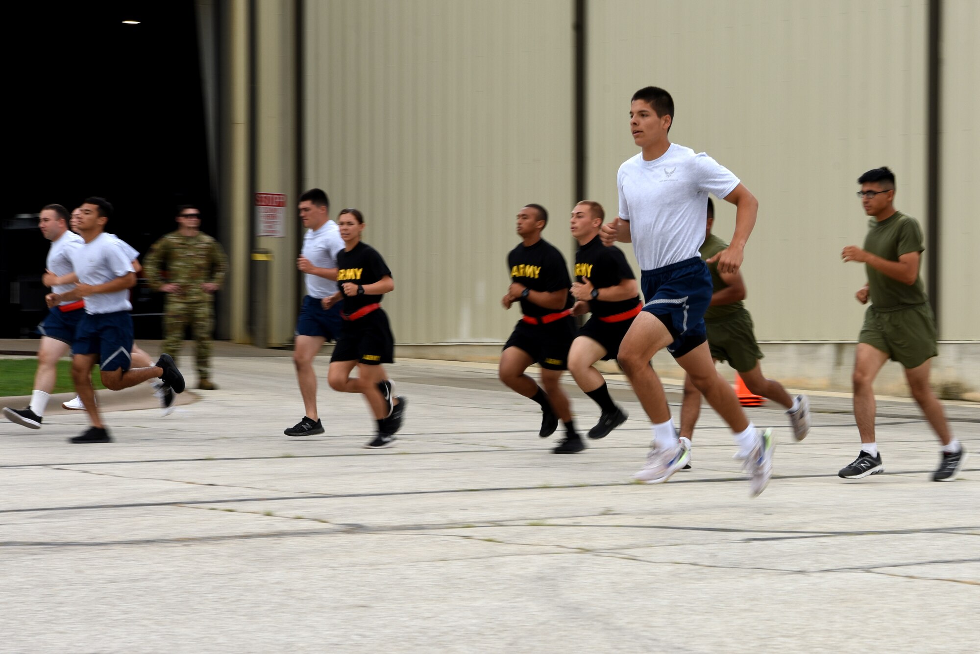 Joint service students assigned to the 312th Training Squadron run in a 20-meter pacer test for a medical evaluation, on Goodfellow Air Force Base, Texas, June 30, 2021. Goodfellow’s Human Performance Team conducted several tests on the new students to mitigate training mishaps. (U.S. Air Force photo by Senior Airman Abbey Rieves)