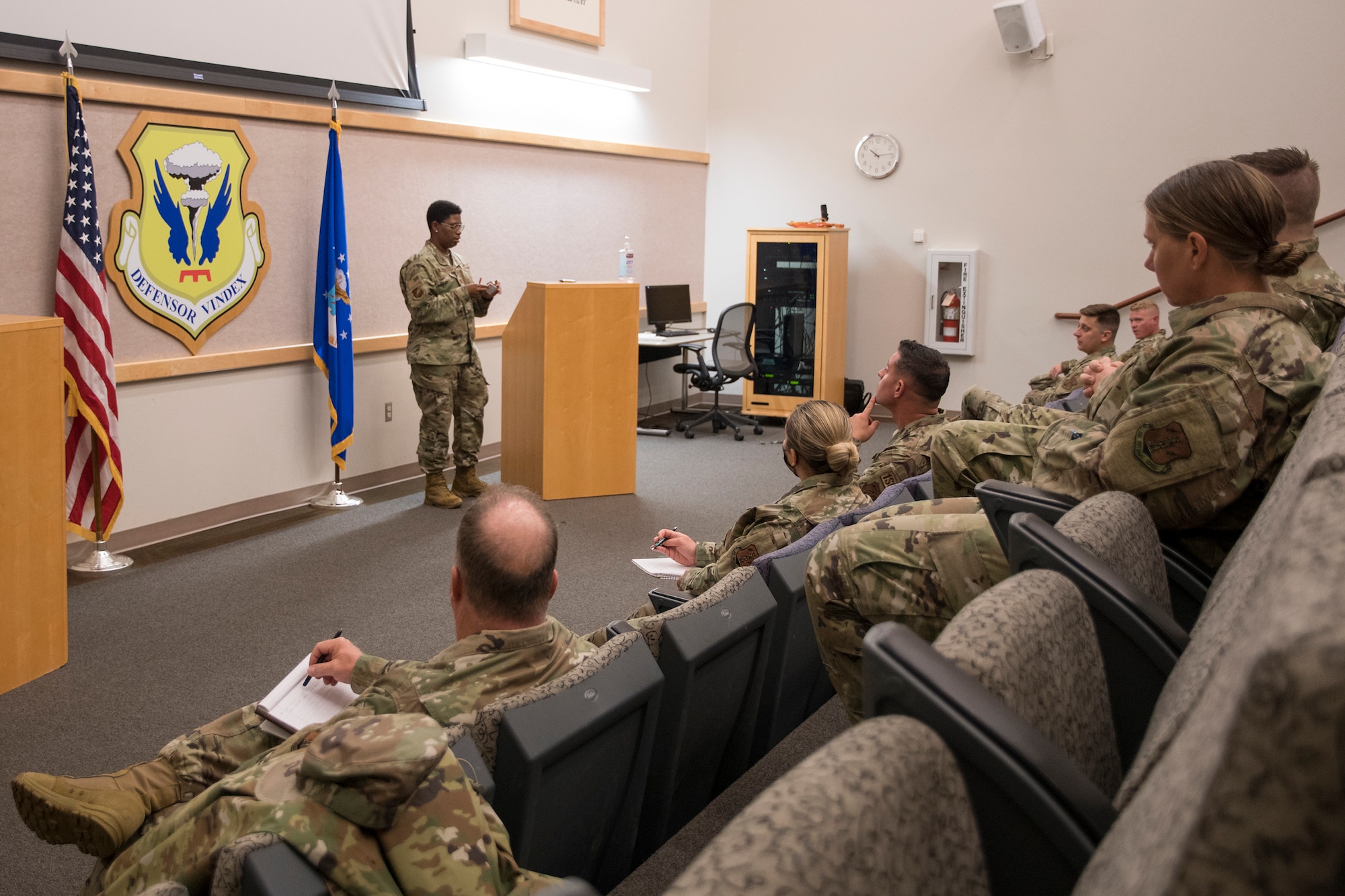 Missouri Air National Guard Capt. Ciarra Schlutow, the 131st Bomb Wing interim student flight officer-in-charge, addresses new student flight sponsors during training, July 10, 2021, at Whiteman Air Force Base, Missouri. Student flight sponsors help new incoming service members become familiar with the Air Force and the units they will be joining after basic military training and technical school. (U.S. Air National Guard photo by Airman 1st Class Whitney Erhart)