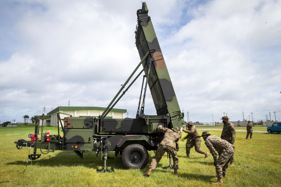 U.S. Marines with 12th Marine Regiment, 3d Marine Division, adjust a Ground/Air Task Oriented Radar system at Marine Corps Air Station Futenma, Okinawa, Japan, Aug. 10, 2020. The G/ATOR provides an air defense and surveillance capability and is used to locate enemy weapon systems. Having these capabilities further enhances Marines’ missions and increases lethality. G/ATOR is one of the Corps’ key capabilities supporting Force Design 2030. (U.S. Marine Corps photo by Cpl. Savannah Mesimer)