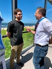 young man speaking with Medal of Honor Recipient, David Bellavia