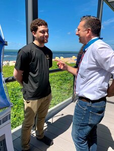 young man speaking with Medal of Honor Recipient, David Bellavia