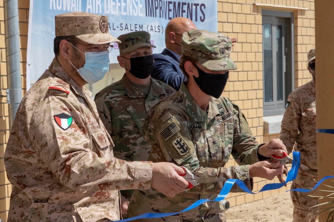 U.S. Army Brig. Gen. Kimberly M. Colloton, commanding general and division engineer of the U.S. Army Corps of Engineers Transatlantic Division, and Kuwait Army Maj. Gen. Adel Al Hafez, commander with the Kuwait Air Defense Forces, cut the ribbon at the new Patriot Fire Site, Site #7, Kuwait, July 5, 2021. The new Air Defense site will expand the Kuwait Ministry of Defense’s defense capabilities and enable assured protection to Kuwaiti citizens and allies.