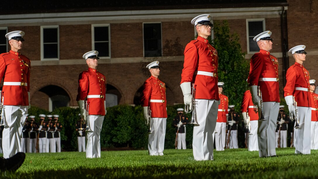 Marines with “The Commandant’s Own,” U.S. Marine Drum and Bugle Corps, perform during the Friday Evening Parade at Marine Barracks Washington, July 9, 2021. The hosting official for the evening was Gen. David H. Berger, Commandant of the Marine Corps, and the guest of honor was The Honorable Thomas W. Harker, Acting Secretary of the Navy. (U.S. Marine Corps photo by Sgt. Jason Kolela)