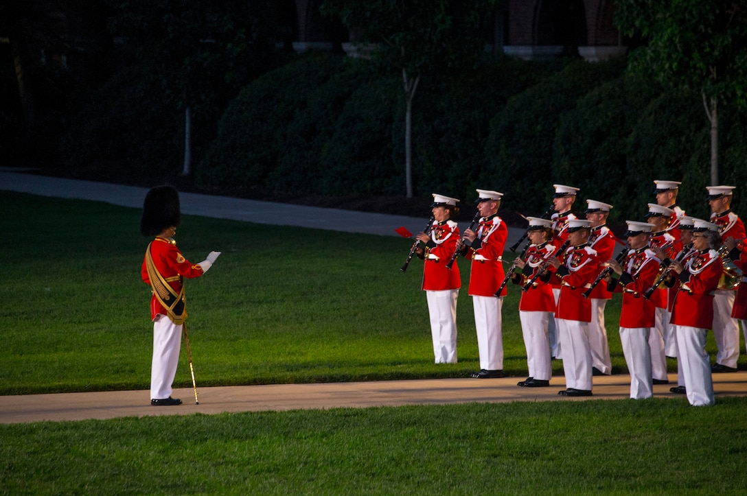 Marines with the “The President’s Own,” U.S. Marine Band, perform during the Friday Evening Parade at Marine Barracks Washington, July 9, 2021. The hosting official for the evening was Gen. David H. Berger, Commandant of the Marine Corps, and the guest of honor was The Honorable Thomas W. Harker, Acting Secretary of the Navy. (U.S. Marine Corps photo by Lance Cpl. Mark Morales)