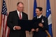 Richard Aldridge, program executive officer for Business and Enterprise Systems and director of the Business and Enterprise Systems Directorate at Maxwell Air Force Base, Ala., presents Col. Martha Monroe with a certificate during a retirement ceremony at Hanscom Air Force Base, Mass., July 9.