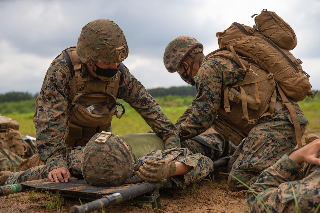 U.S. Marines and Sailors with 3rd Battalion, 12th Marine Regiment, 3rd Marine Division, conduct medical evacuation training during the Artillery Relocation Training Program 21.2 at Ojojihara Maneuver Area, Japan, July 13, 2021. ARTP provides realistic, live-fire training opportunities to the only permanently forward-deployed artillery unit in the Marine Corps, enabling them to provide precision indirect fires from a distributed environment in support of maritime operations. The training contributes to the defense of Japan and the U.S.-Japan Alliance as the cornerstone of peace and security in the Indo-Pacific region.