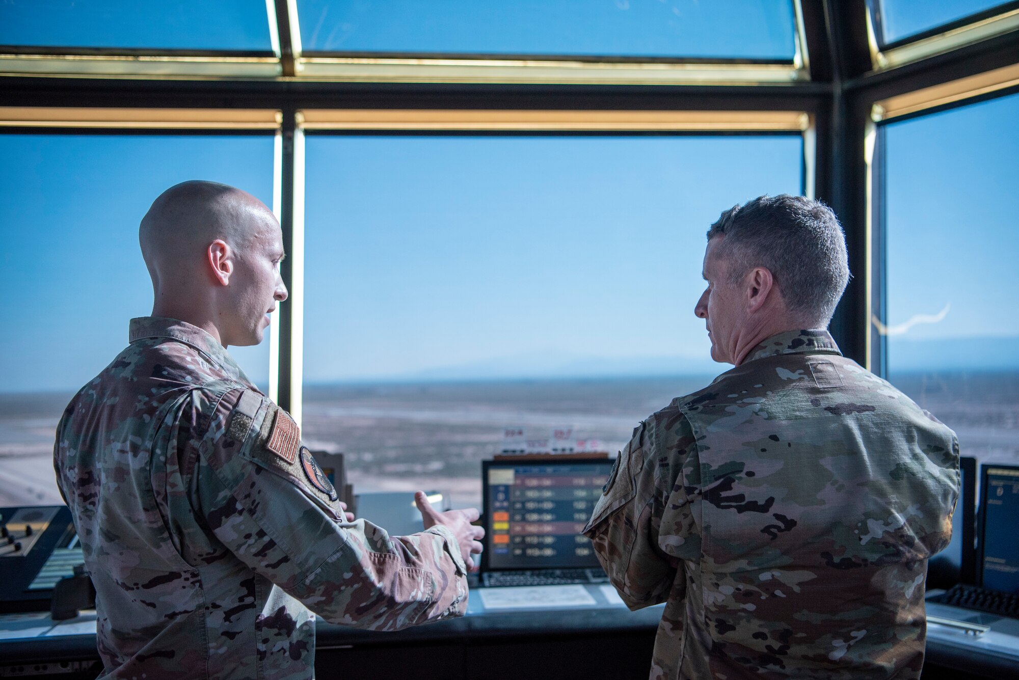 U.S. Air Force Staff Sgt. Corey Jones, 54th Operations Support Squadron tower watch supervisor, shows U.S. Army Brig. Gen. Eric Little, White Sands Missile Range commander, the air traffic control tower, July 9, 2021, on Holloman Air Force Base, New Mexico. Little visited Holloman AFB to familiarize with local operations and tour partner units. (U.S. Air Force photo by Airman 1st Class Jessica Sanchez)