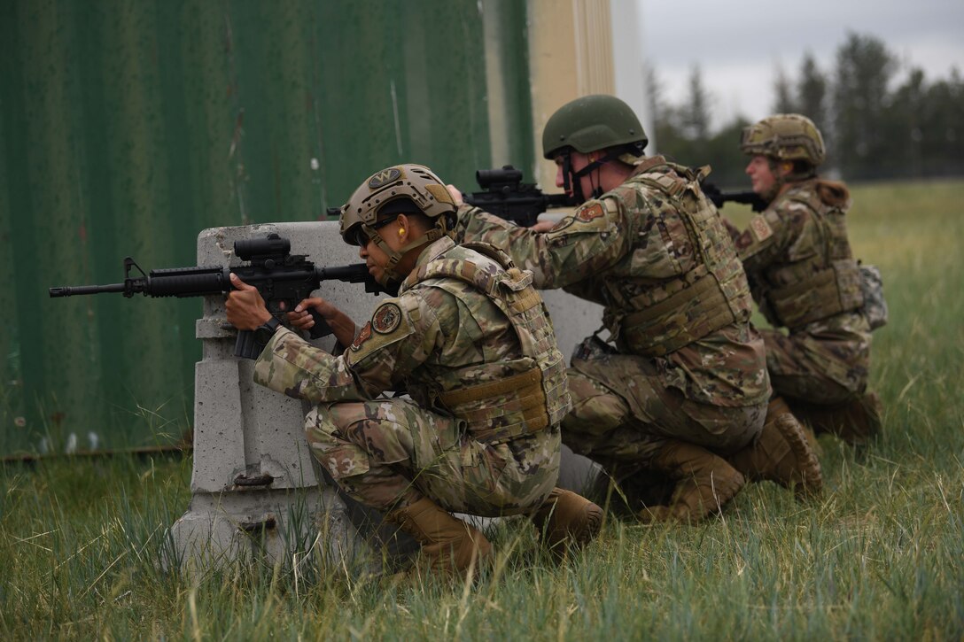 Airmen with the 90th Civil Engineering Squadron practice the handling of weapons in a shoot no-shoot challenge during the 90 CES Readiness Challenge on F.E. Warren Air Force Base, Wyoming, July 1, 2021. The purpose of the exercise was to train the readiness capabilities of the Airmen with the 90 CES. (U.S. Air Force photo by Airman 1st Class Darius Frazier)