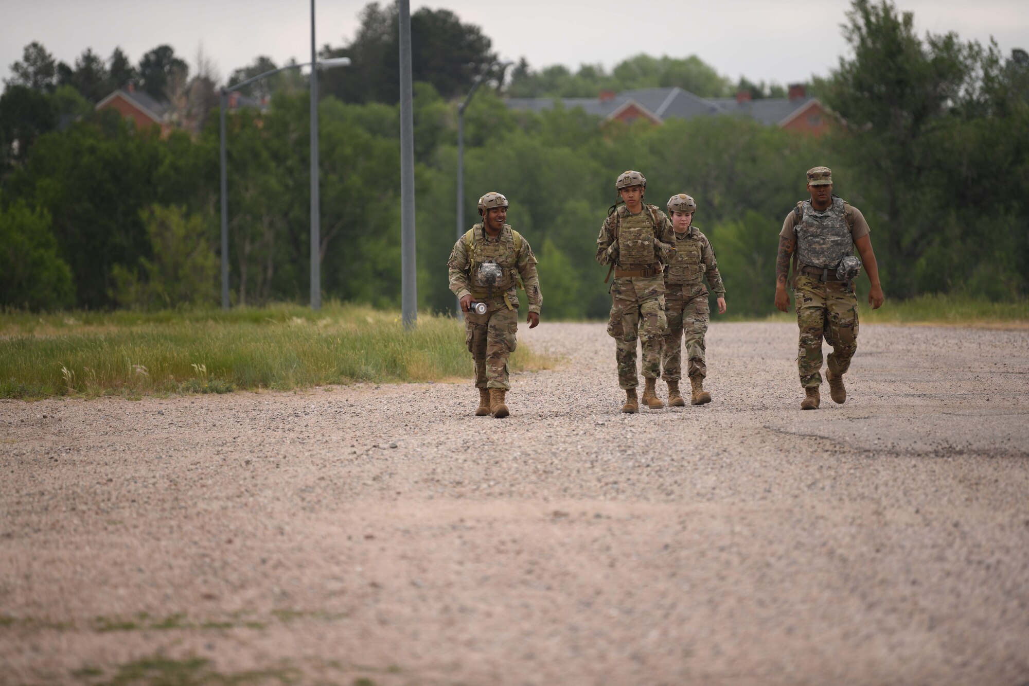 A group of Airmen participate in a ruck during the 90th Civil Engineering Squadron Readiness Challenge on F.E. Warren Air Force Base, Wyoming, July 1, 2021. The purpose of the exercise was to train the readiness capabilities of the Airmen with the 90 CES. (U.S. Air Force photo by Airman 1st Class Darius Frazier)