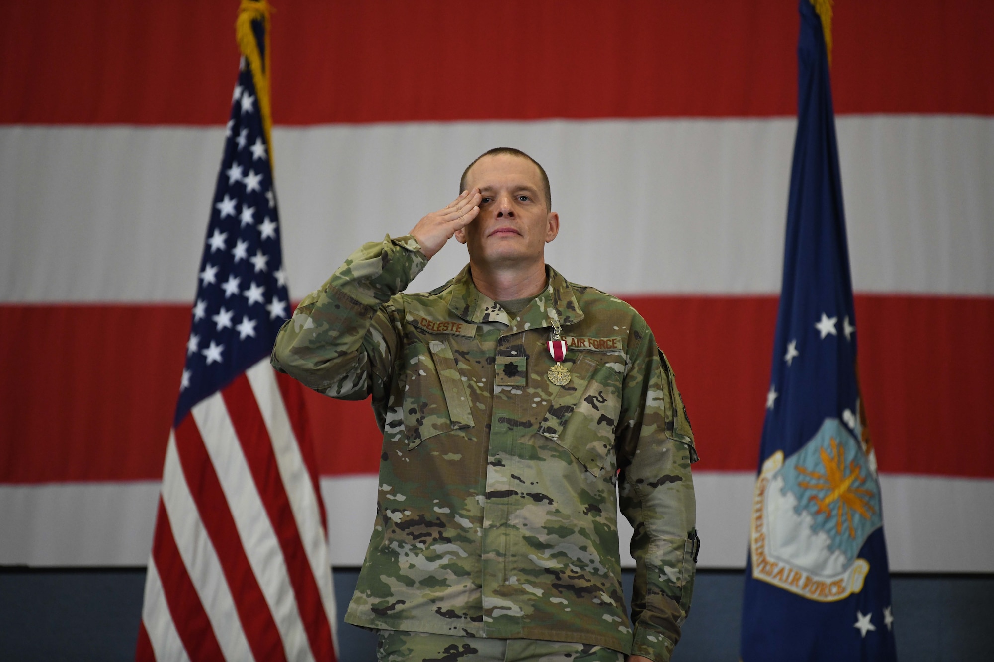 Lt. Col David Celeste, outgoing commander of the 90th Missile Security Forces Squadron, renders his final salute to his troops during the 90 MSFS change of command ceremony in the Peacekeeper High Bay on F.E. Warren Air Force Base, Wyoming, July 13, 2021. The ceremony is to signify the transition of authority from Celeste to Lt. Col. William Brokaw, incoming commander of the 90th Missile Security Forces Squadron. (U.S. Air Force photo by Airman 1st Class Darius Frazier)