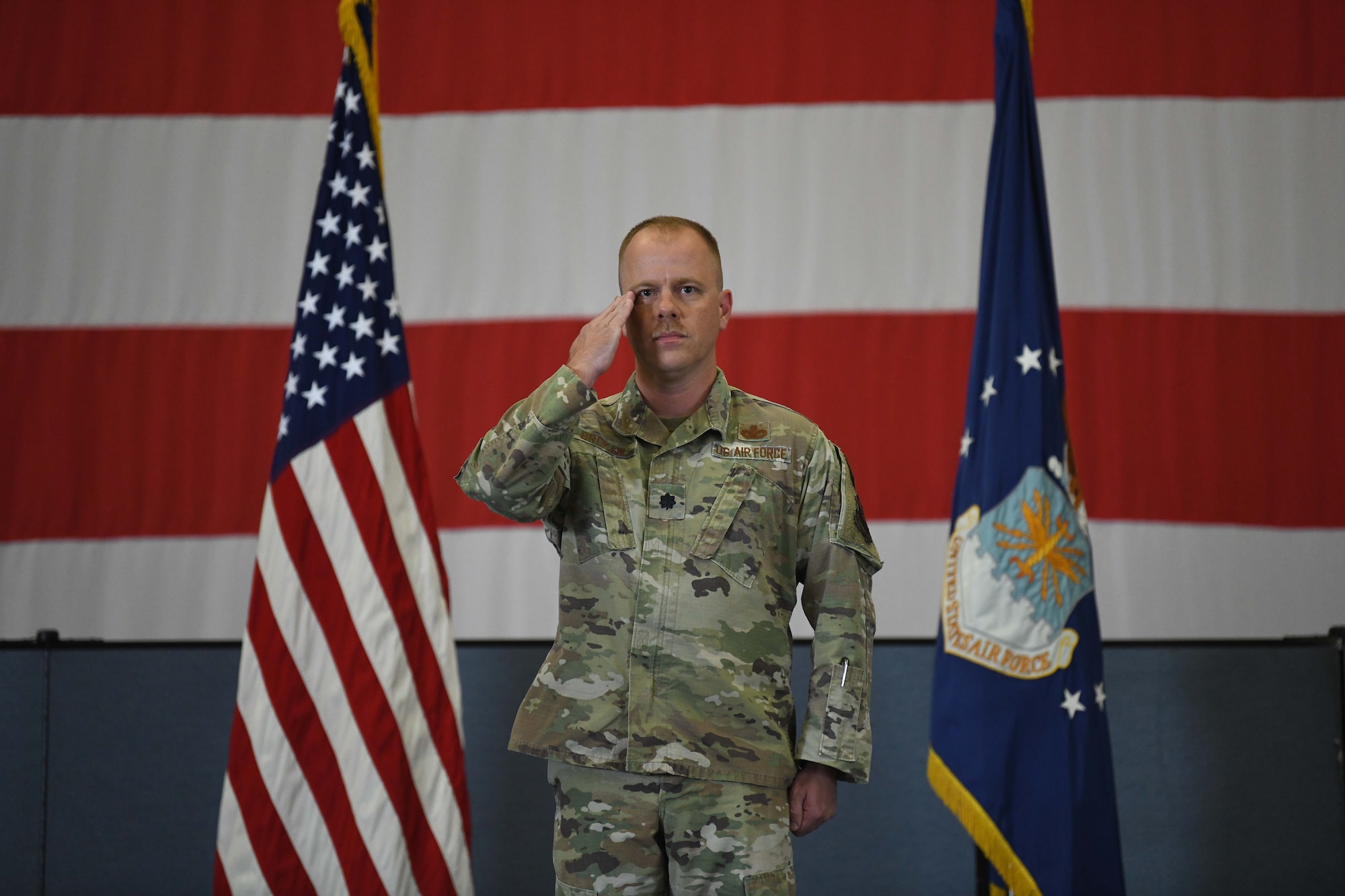Lt. Col. William Brokaw, incoming commander of the 90th Missile Security Forces Squadron, renders his first salute to his troops during the 90 MSFS change of command ceremony in the Peacekeeper High Bay on F.E. Warren Air Force Base, Wyoming, July 13, 2021. The ceremony is to signify the transition of authority from Lt. Col David Celeste, outgoing commander of the 90th Missile Security Forces Squadron, to Brokaw. (U.S. Air Force photo by Airman 1st Class Darius Frazier)